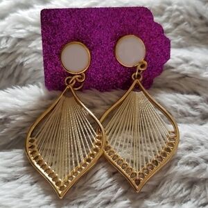 Gold and cream earrings with white stud.
